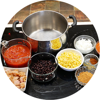 Food ingredients in containers on a stove