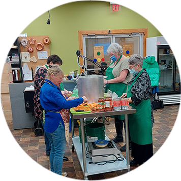 People making soup in a kitchen