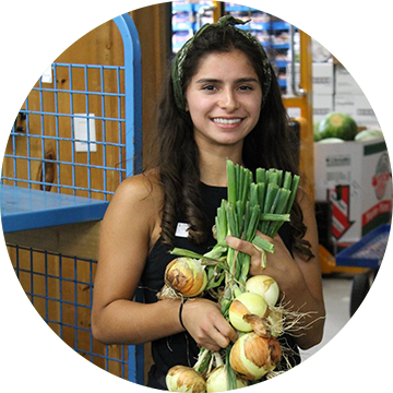 Young lady holding vegetables